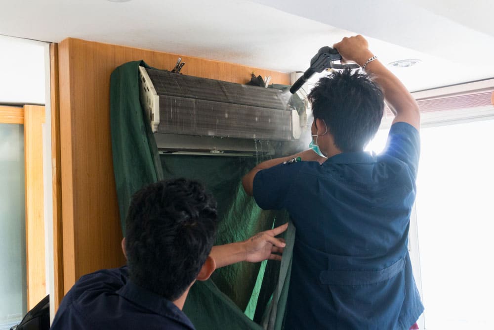 cleaning home air conditioner in summer